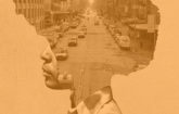 a silhouette of a human being with a old-time city scene in the silhouette