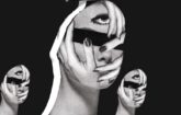 an abstract image of a face with its eyes covered with hands